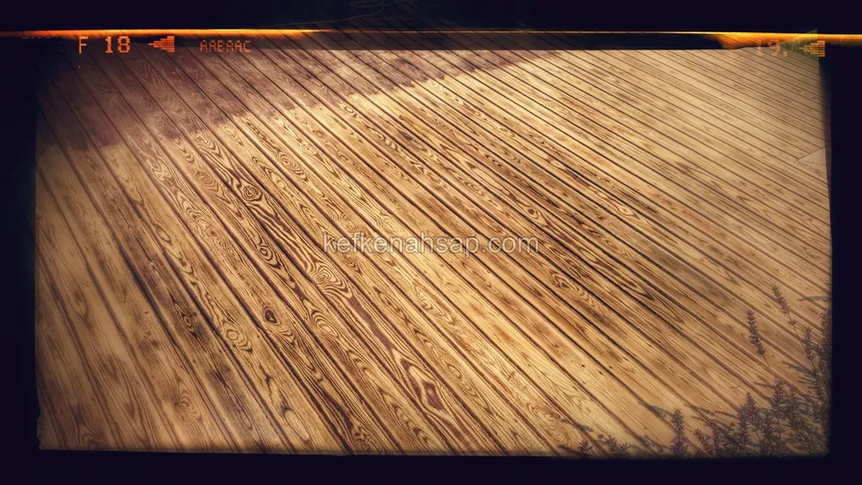 Close-up of diagonally laid golden-toned deck boards with pronounced grain and knot marks