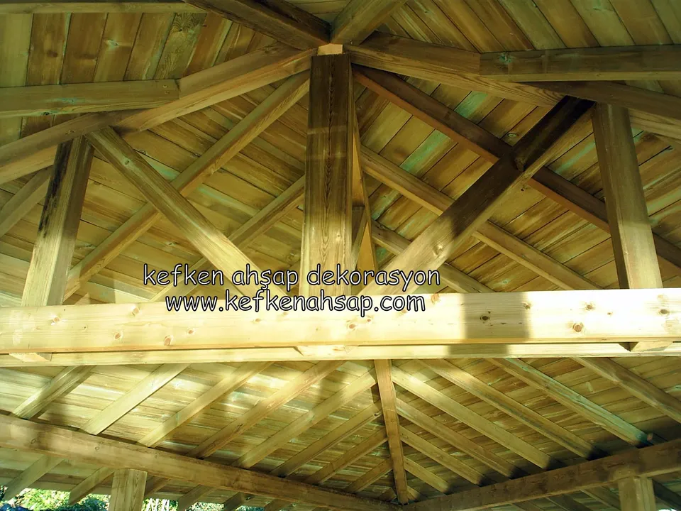 Underside of a gazebo roof: beams fanning out from the centre, diagonal braces and light lining boards